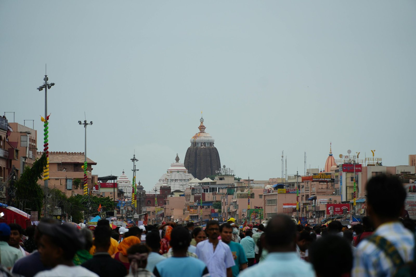 A crowded street near the iconic Jagannath Temple in Puri captures vibrant cultural life.