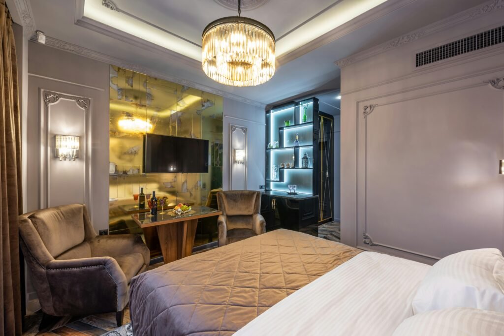 Cozy modern bedroom featuring chic furniture, elegant lighting, and a stylish decor setup.